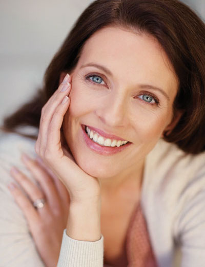 Smiling woman, showing cosmetic dentistry work done by Robert Tartaglione DDS