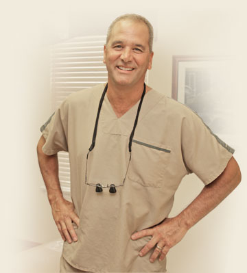 Staff member of Dr. Tartaglione standing by her dental equipment